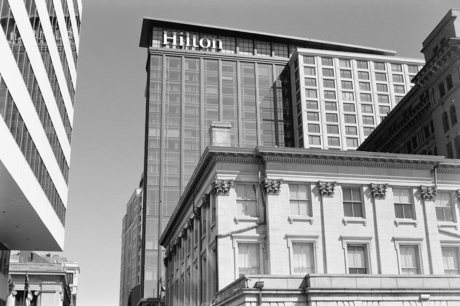 Hilton sign above downtown buildings