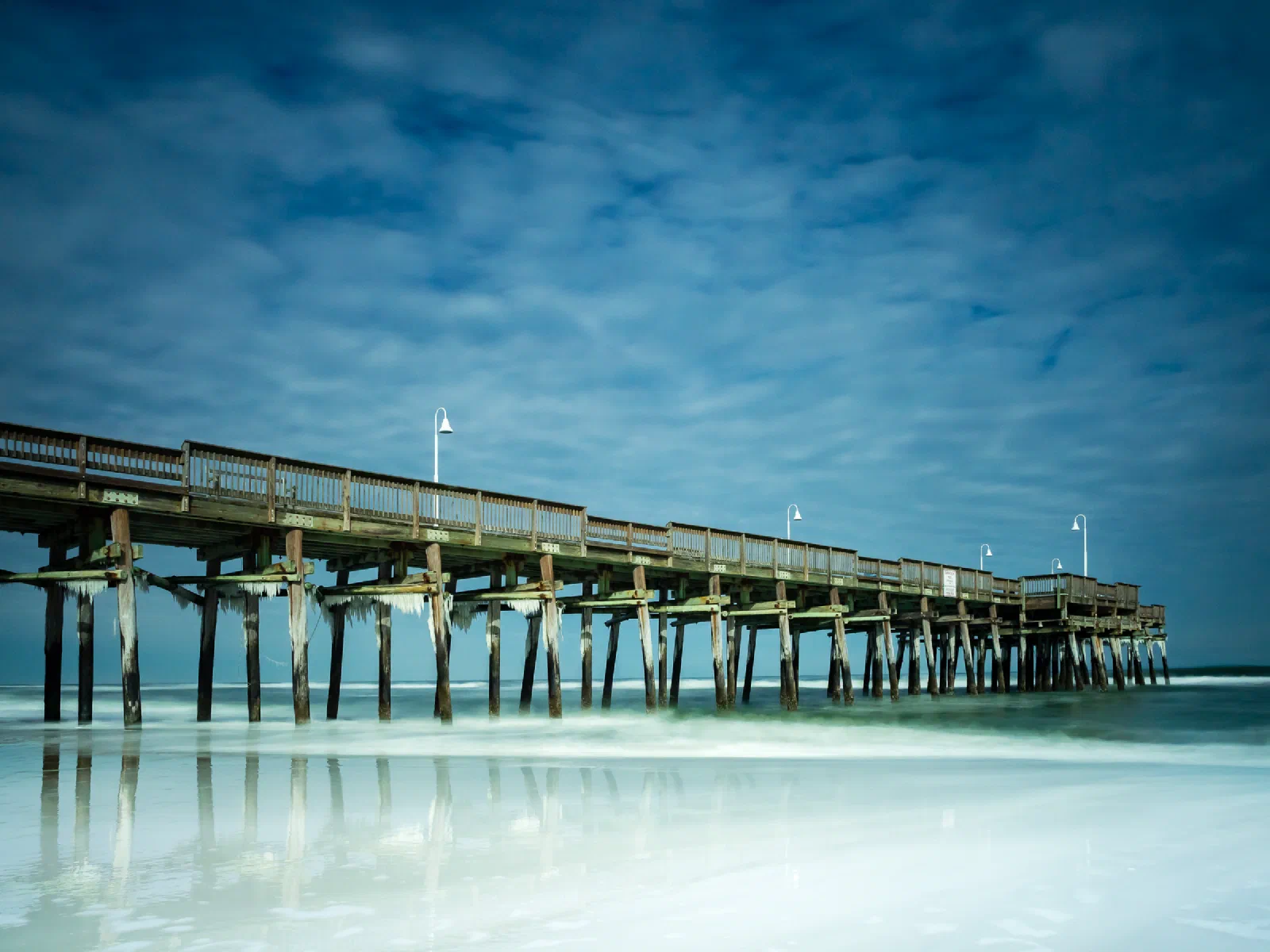 Icicles hanging beneath Little Island Fishing Pier on a winter day